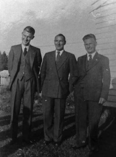 Three men wearing suits